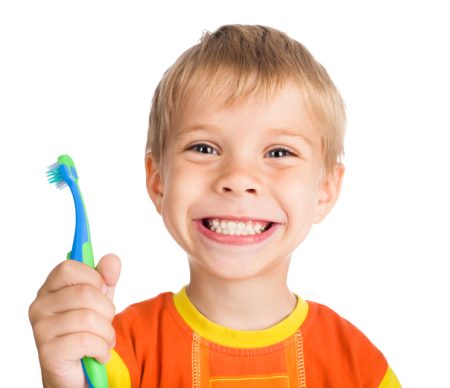 Smiling little boy with toothbrush